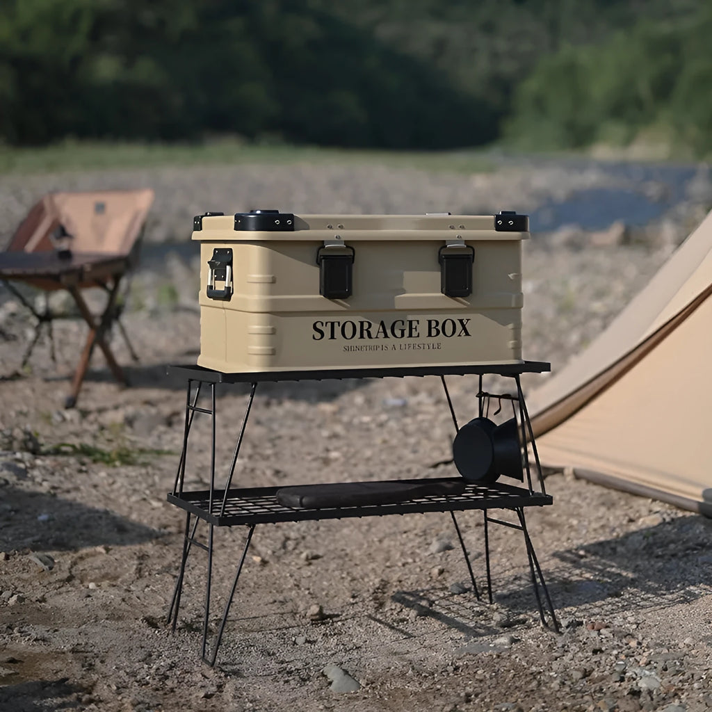 Army green waterproof plastic storage box sitting in a car boot