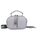 Women's small square bag with stitching detail showing oval shape and double shoulder straps