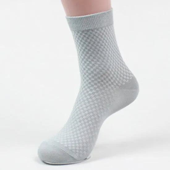 Men's bamboo fibre ankle socks in black, navy, silver grey, iron grey, and grey blue with a small square pattern.