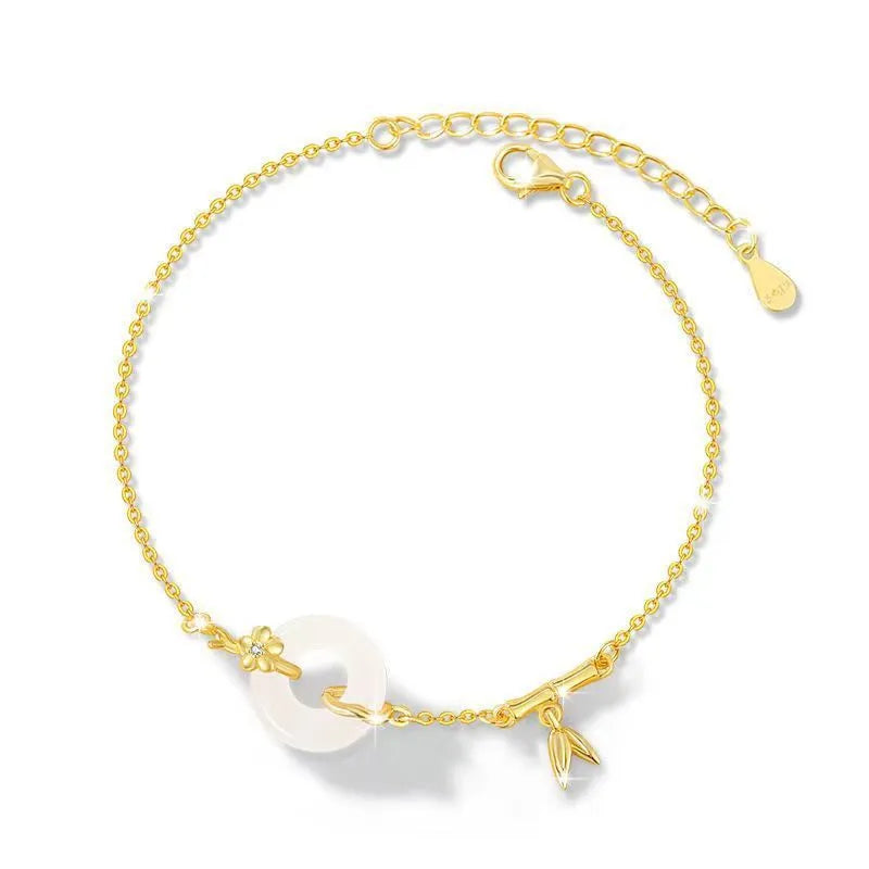 Silver women's bracelet with peace buckle charm, white chalcedony stone, and starry sky design with gold electroplating.
