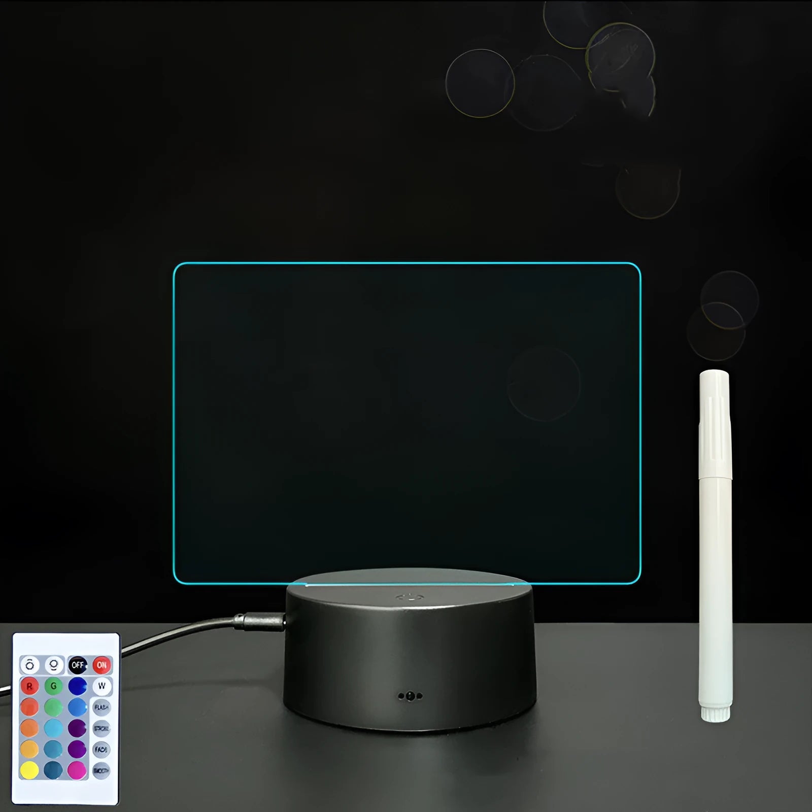 3D acrylic LED message board with touch control, black ABS base, USB cable, and stylus pen on desk