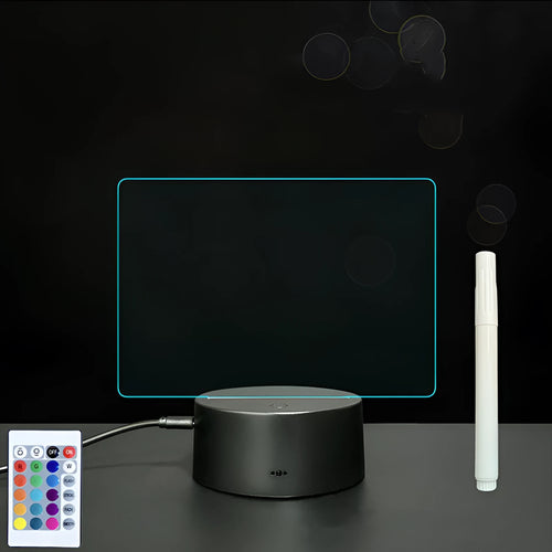 3D acrylic LED message board with touch control, black ABS base, USB cable, and stylus pen on desk