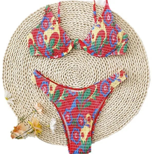 Red floral patterned women's underwire triangle bikini top and briefs on a mannequin.