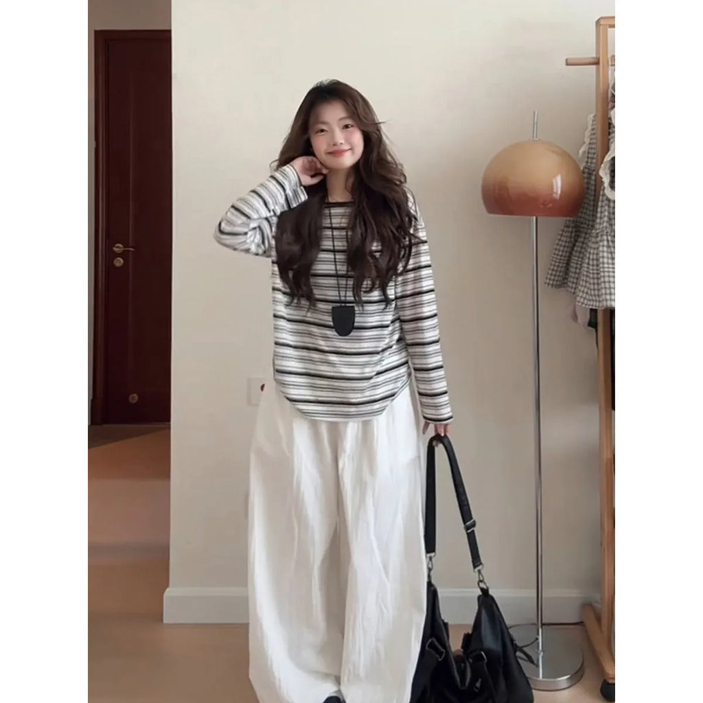 Striped long sleeve relaxed fit T-shirt in black stripes for sun protection, polyester fabric