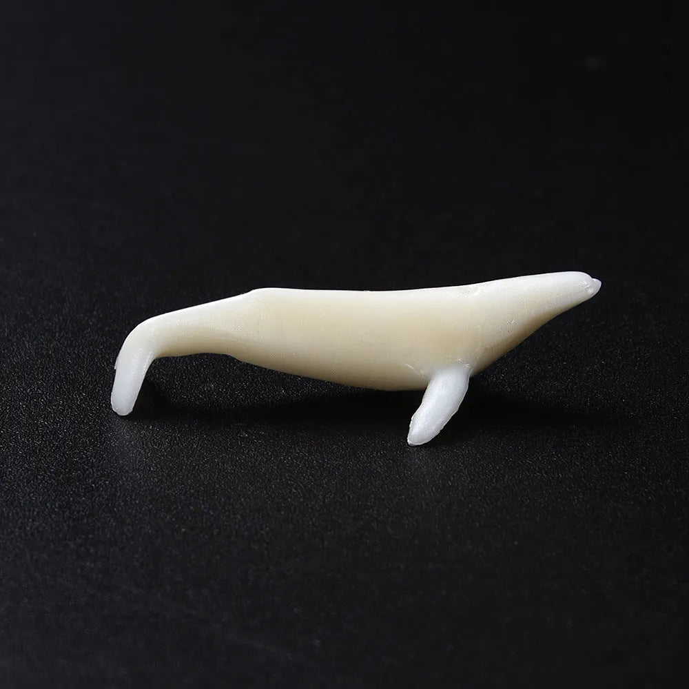 Plastic crystal glue ocean whale model in jump water humpback pose