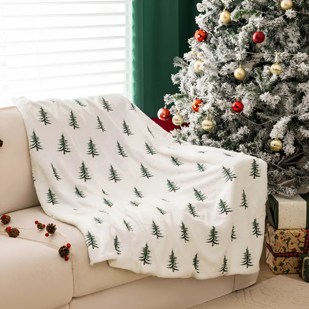 Christmas plush sofa blanket with embroidered tree design, white polyester, 127x152cm, on a sofa