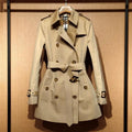 Women's khaki trench coat with double-breasted buttons and flight sleeves
