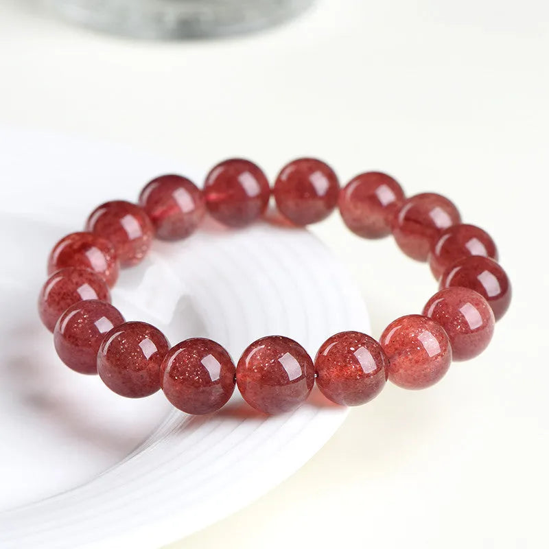 Natural strawberry quartz bracelet in starlight cherry red colour with geometrically shaped crystal beads