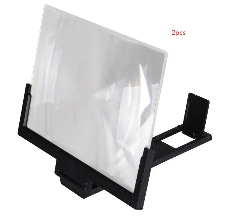 A black magnifying mobile phone stand holding a smartphone, showing the enlarged screen through the acrylic lens.