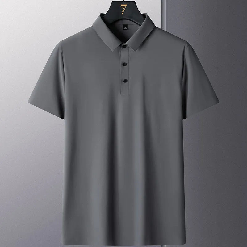 Man wearing a solid colour short sleeve non-ironing business casual shirt in a neutral tone.