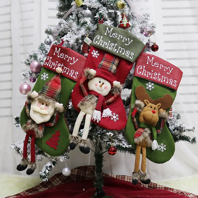 Set of three large red, white, and brown Christmas stockings featuring Santa, Snowman, and Reindeer 3D designs.