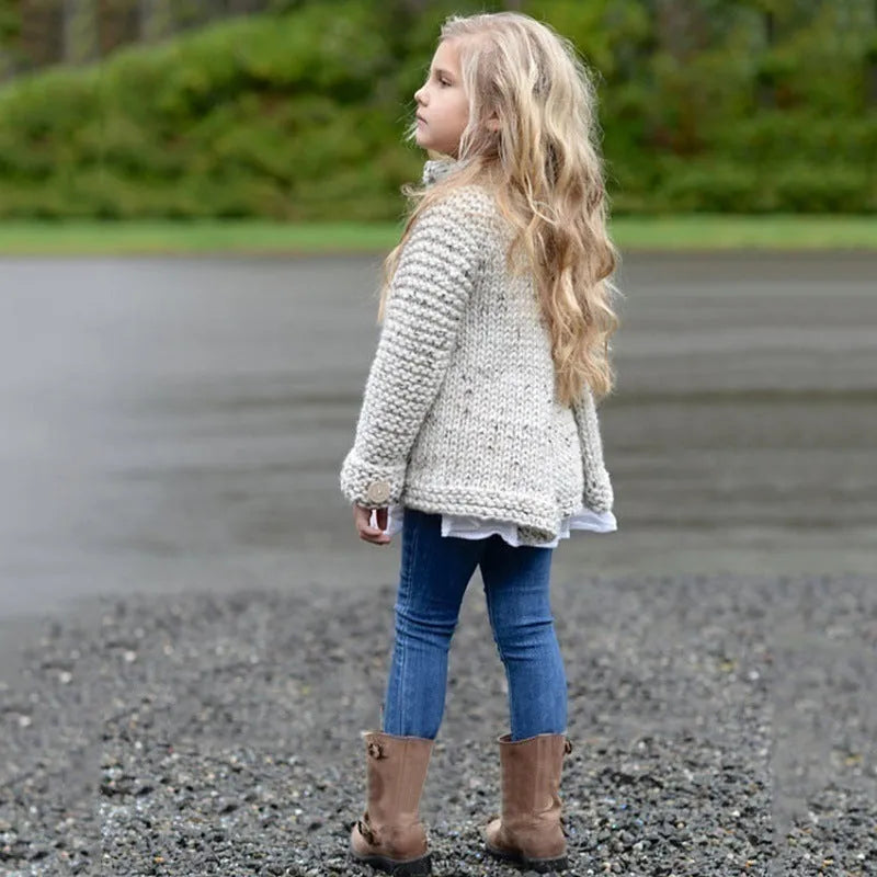 Beige long sleeve girls cardigan sweater coat with single-breasted button closure.