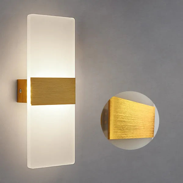Black acrylic LED wall lamp mounted on a wall, measuring 27cm by 10cm.