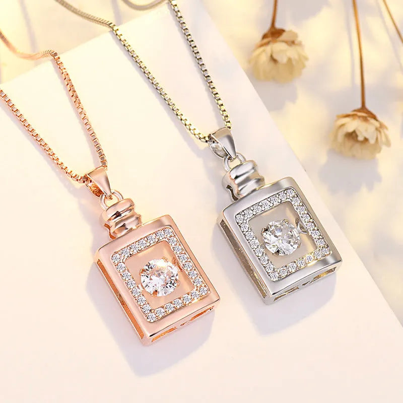 Women's silver heart-shaped necklace pendant featuring a crown and bow design on an adjustable chain.