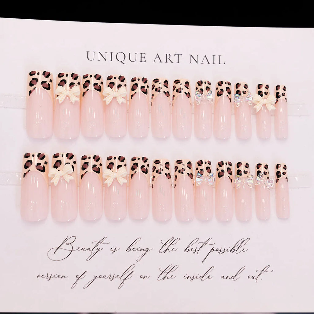 Leopard print pattern on a 3D plastic butterfly nail art charm for manicure decoration.