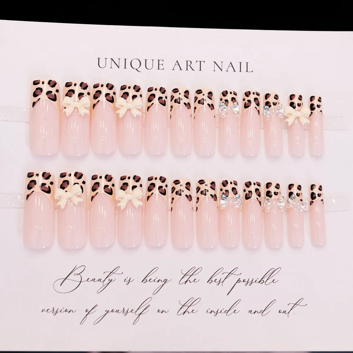 Leopard print pattern on a 3D plastic butterfly nail art charm for manicure decoration.