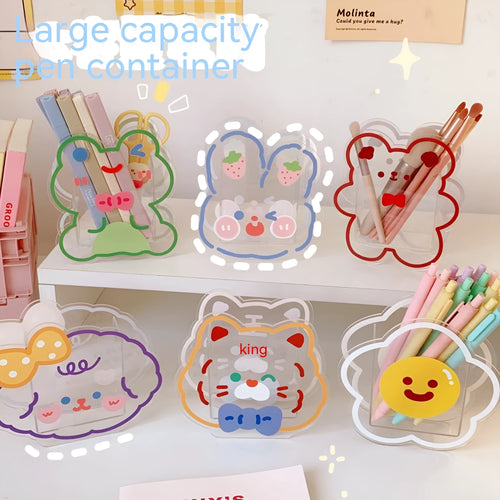 Square transparent acrylic storage box with a cute decorative design, shown on a desk.
