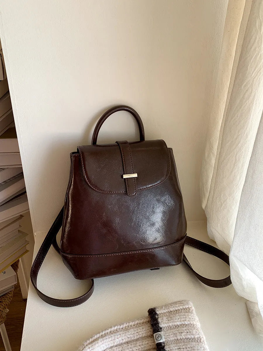 Pibai daily small backpack for women in brown with PU spliced design and compact size