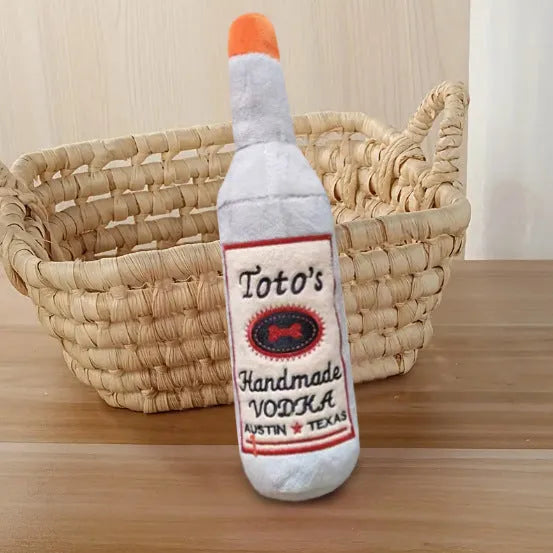 Brown plush wine bottle-shaped dog chew toy with squeaker for aggressive chewers