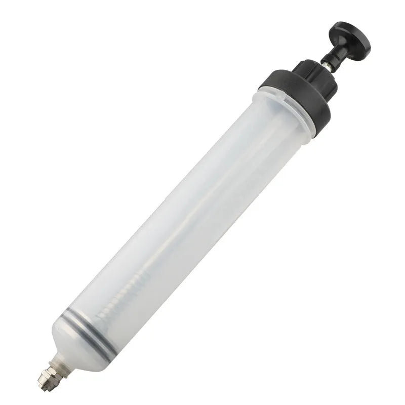 Manual oil change pump tool with syringe-style barrel for precise fluid transfer