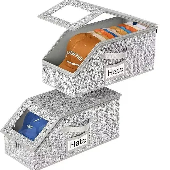 Grey foldable and stackable woven fabric storage box with lid for baseball caps and organisation.