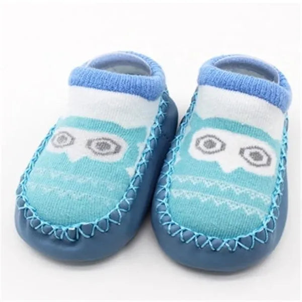 Pair of pastel coloured baby socks with anti-slip dots on the sole, shown flat.