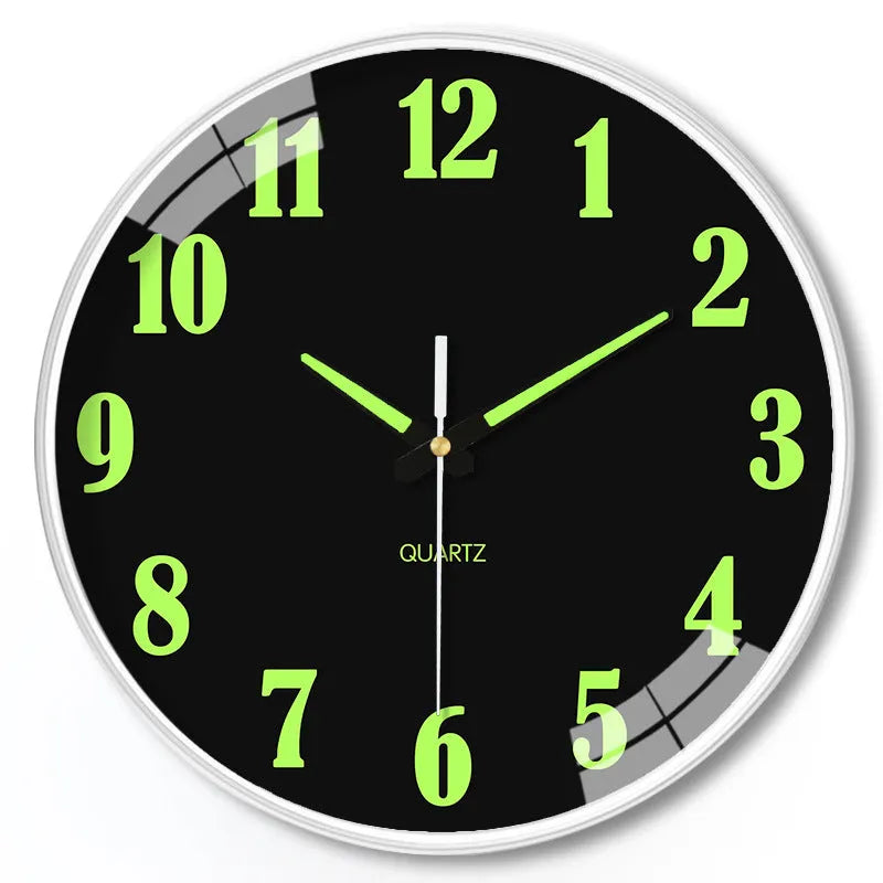 Modern 8 inch luminous wall clock in plastic case on a wall.
