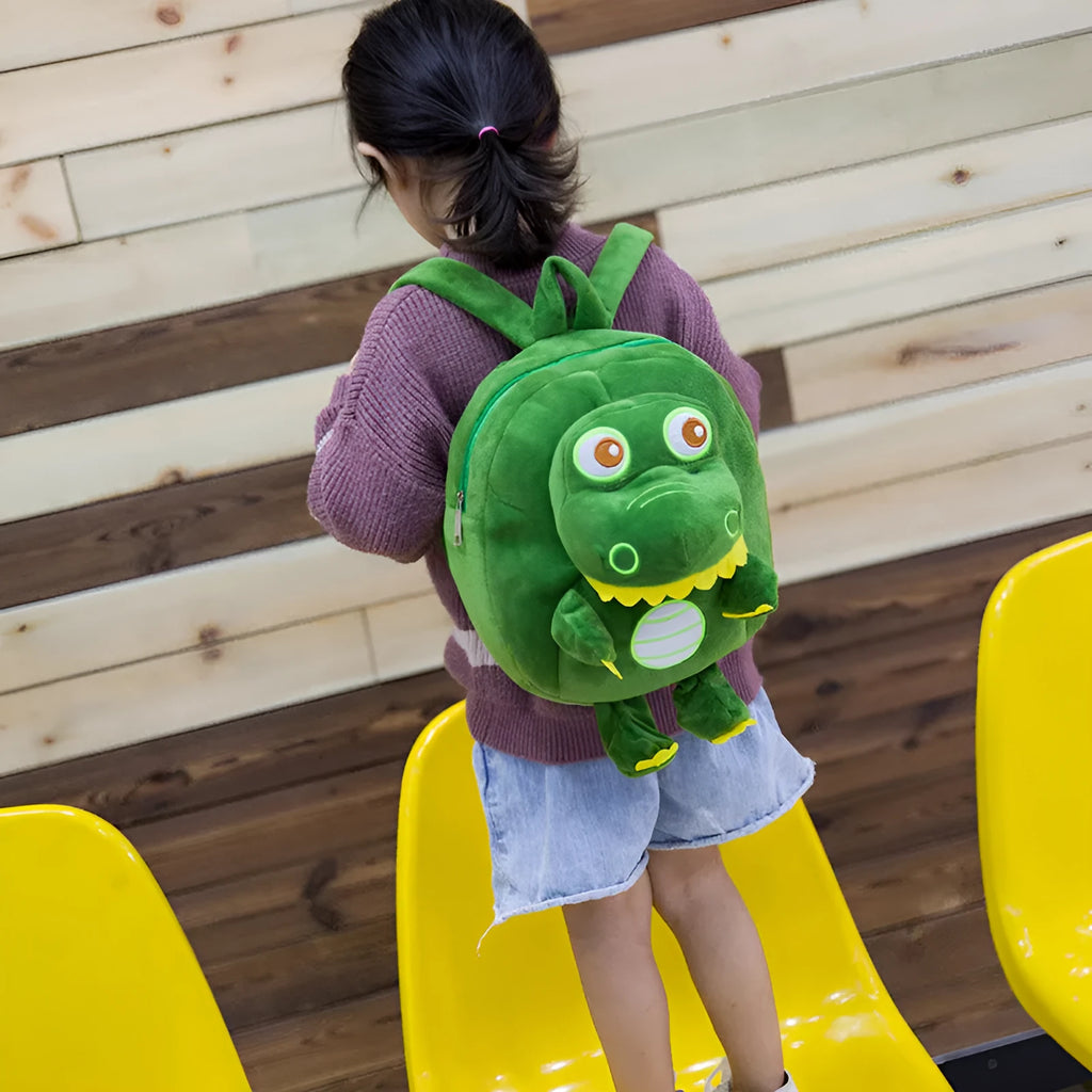 Baby dinosaur plush toy backpack with embroidery design in blue colour showing soft handle and animal pattern