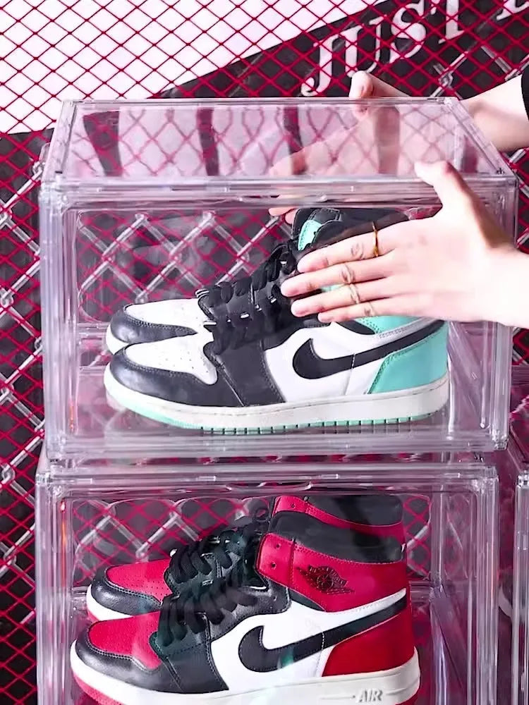 Large transparent acrylic shoe storage box with magnetic side door showing interior shoe storage