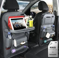 PU leather car seat back organiser with multiple pockets and a detachable bottom waste bin, hanging behind a car headrest.