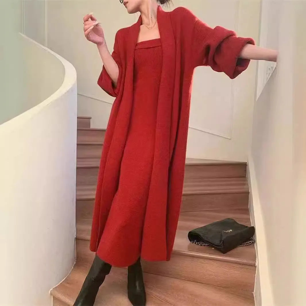 Woman wearing a grey textured flecked long-sleeve dress with a matching open cardigan from a two-piece knit set.