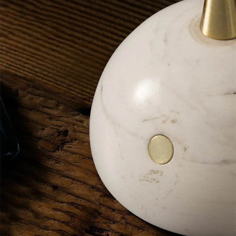 Dimmable touch-controlled desk lamp with glass shade on wooden desk