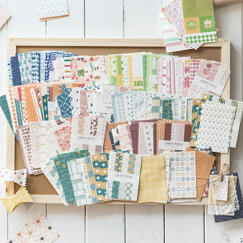 Pack of 50 retro-style decorative note papers with dessert-themed designs in ten colours.