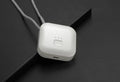 Compact USB-powered air purifier necklace in pink, showing wearable design and one-button control.