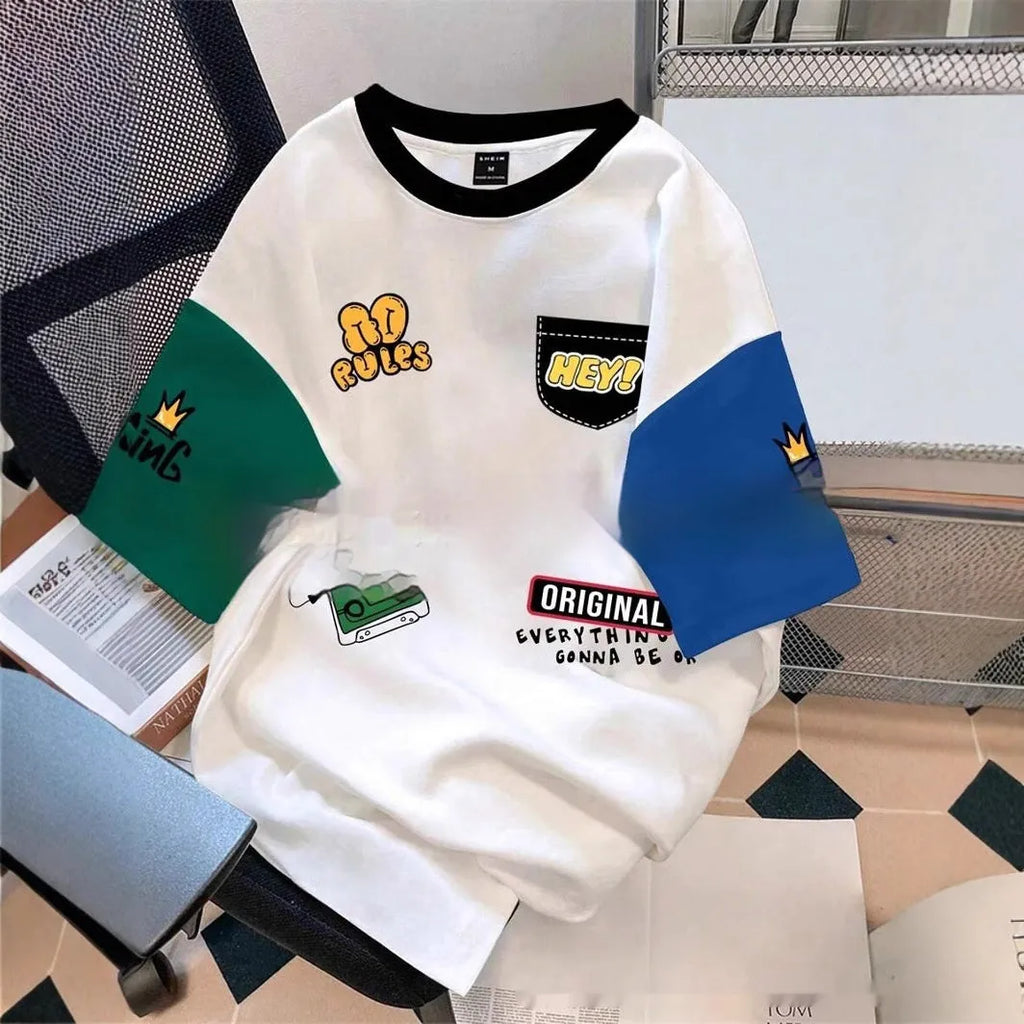 Man wearing a loose-fit casual T-shirt with a printed letter design in a trendy colour.