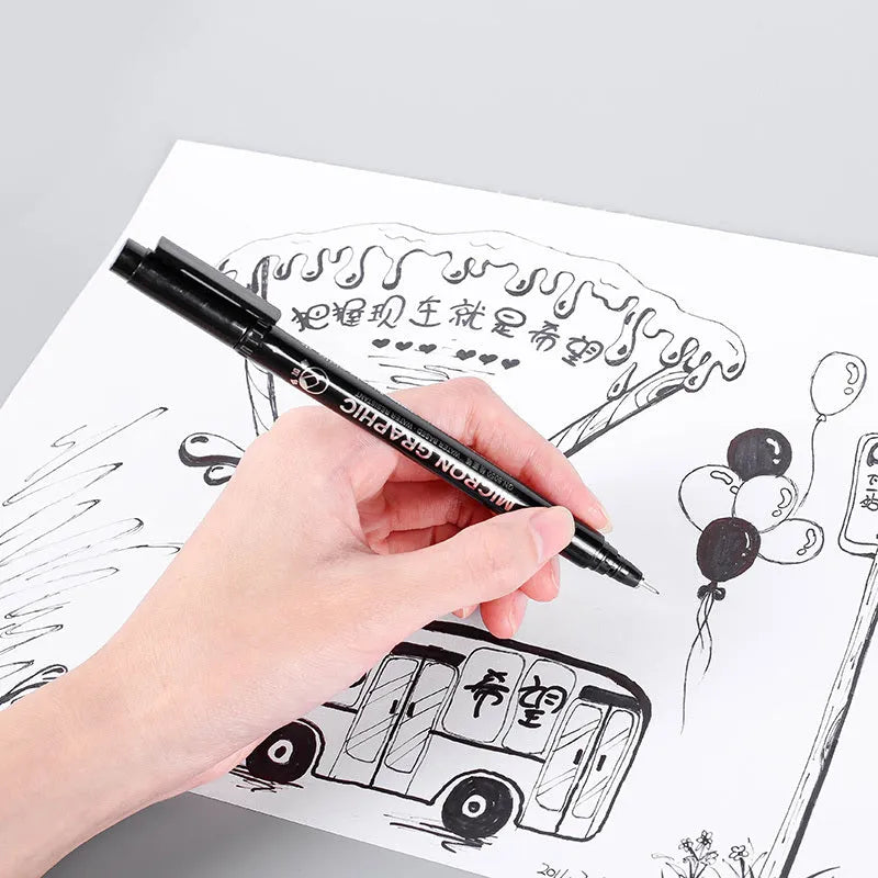Set of 12 black comic drawing pens with assorted microtip nibs in a fabric organiser pouch.