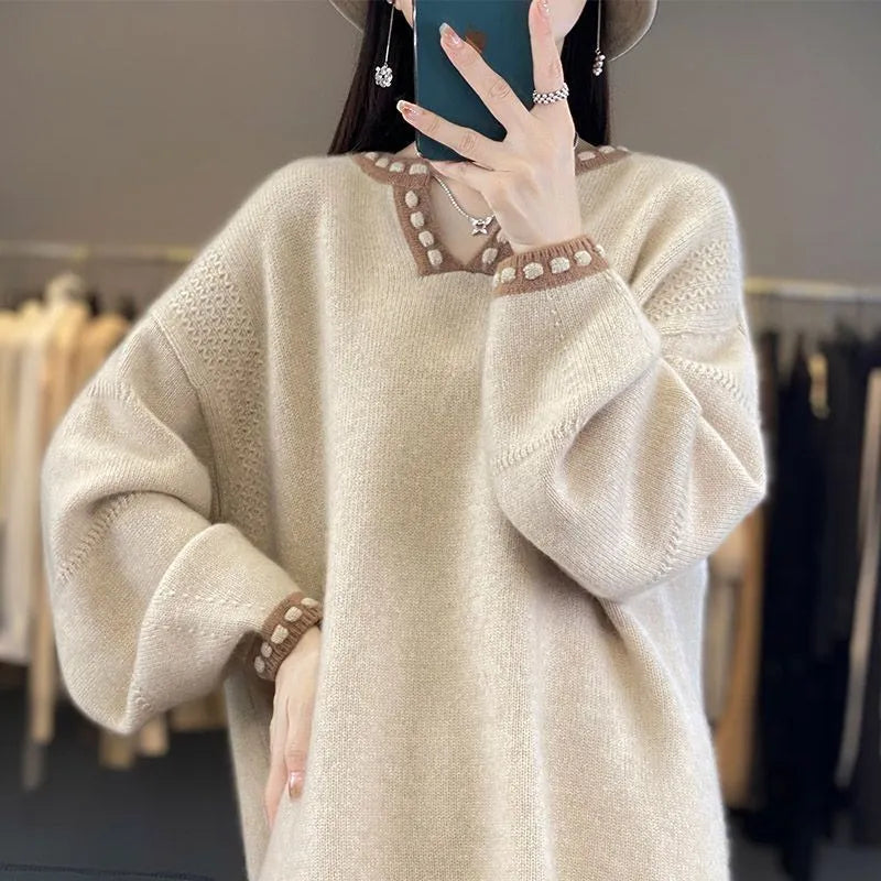 Women's camel coloured V-neck long sleeve viscose knit sweater on a hanger.