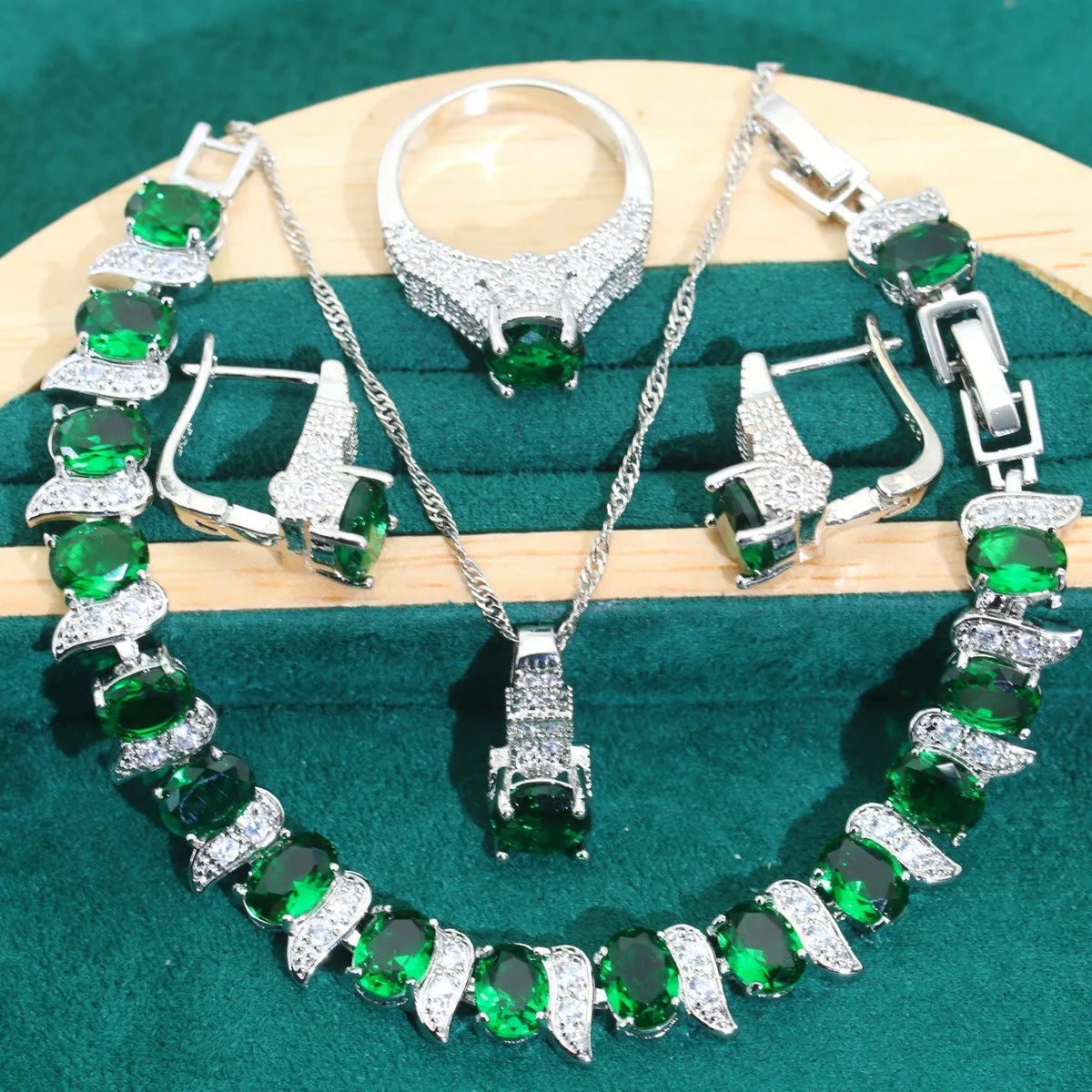 Four-piece bridal jewellery set showing necklace, bracelet, earrings and ring with alloy pendant and water wave chain