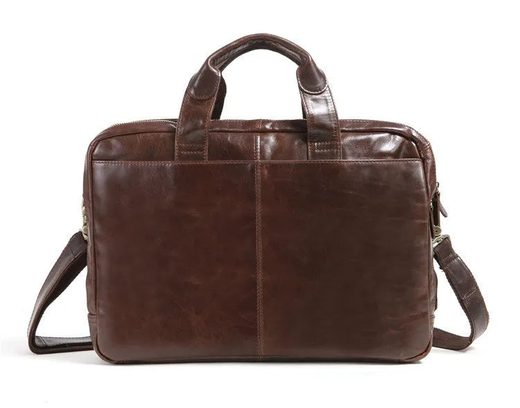 Brown leather men's business briefcase with laptop compartment showing cowhide texture