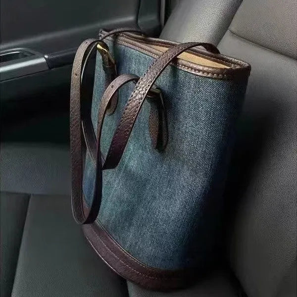 Retro blue denim patchwork one-shoulder bucket bag with large capacity.