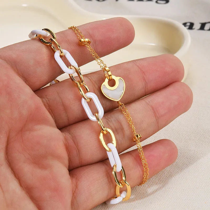 Women's stainless steel and resin bracelet with a double-layer loving heart design.