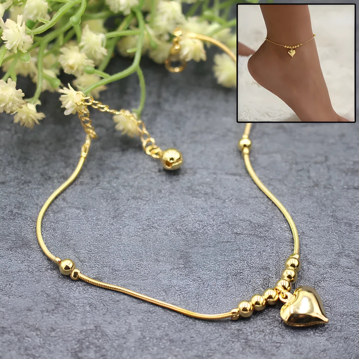 Gold colour gothic heart pendant anklet on a woman's ankle with chunky ball beads and copper chain 27cm
