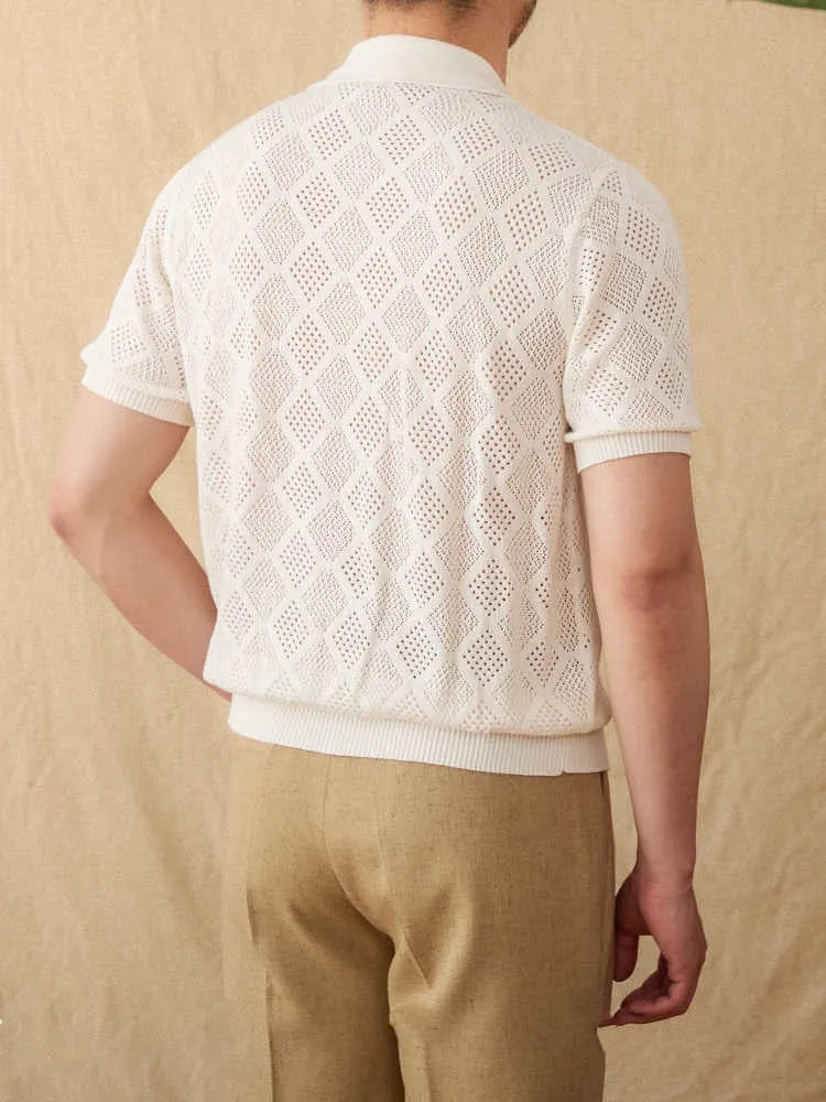 Light brown cotton short sleeve cardigan with a front zipper and lapel collar on a hanger.