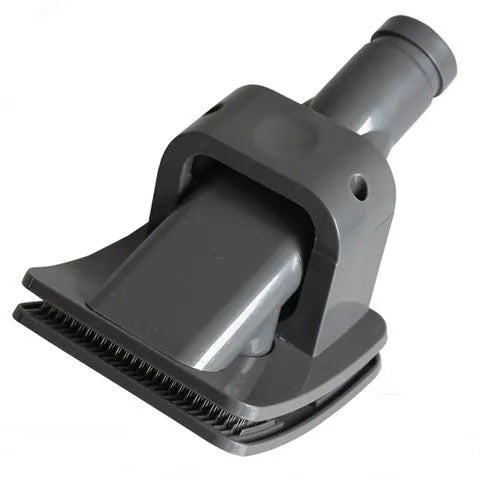 Deep grey pet grooming brush tool with vacuum attachment, 17 x 10 cm, on a plain background