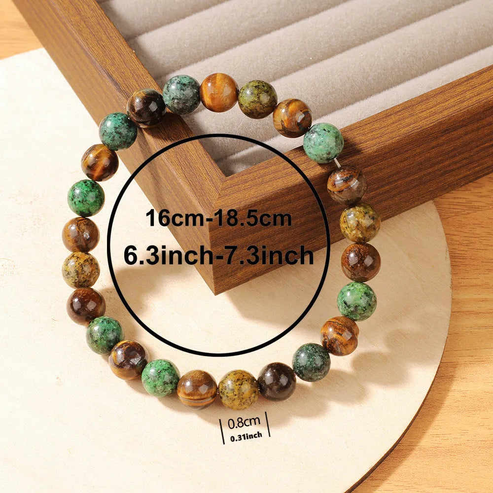 Tiger eye stone bracelet showing antique flower design with natural stone beads