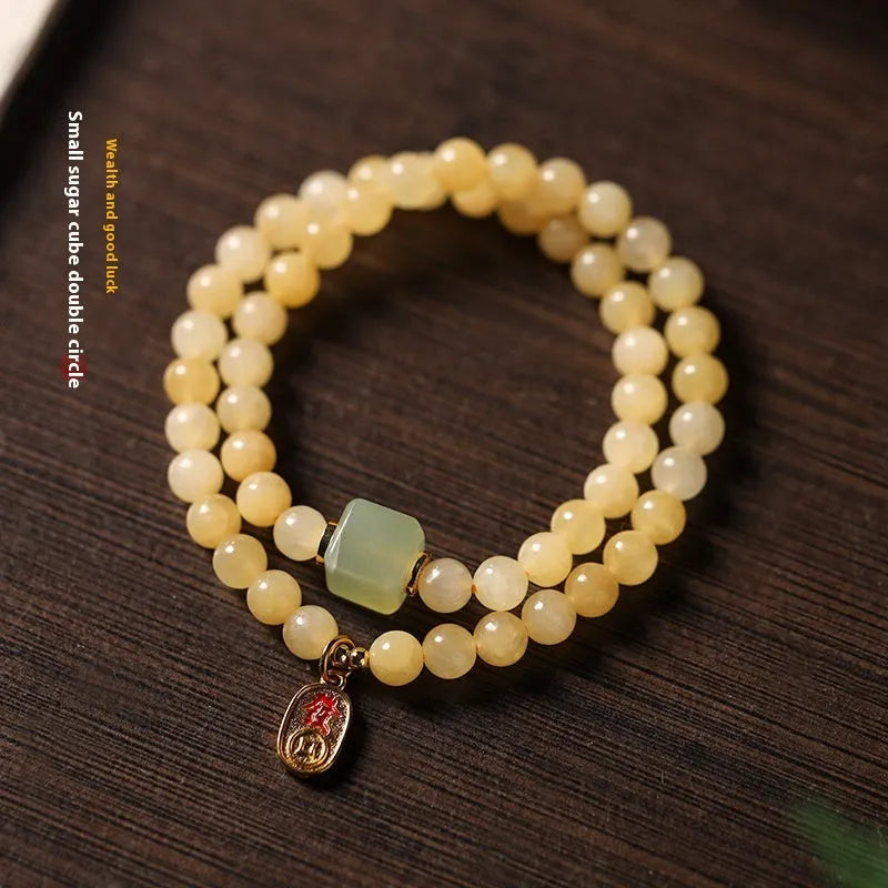 Women's hand-woven topaz bracelet with 6mm mantra barrel beads and square jade charms