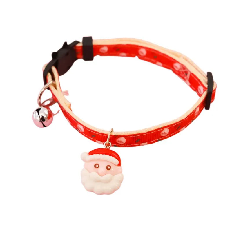 Christmas pet collar with bow tie, bell, and adjustable strap featuring Santa Claus and tree patterns