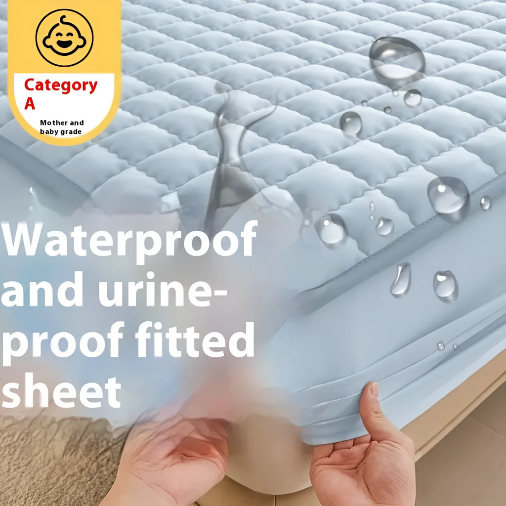 Class A waterproof fitted sheet in washed cotton, shown in a neutral colour on a bed.