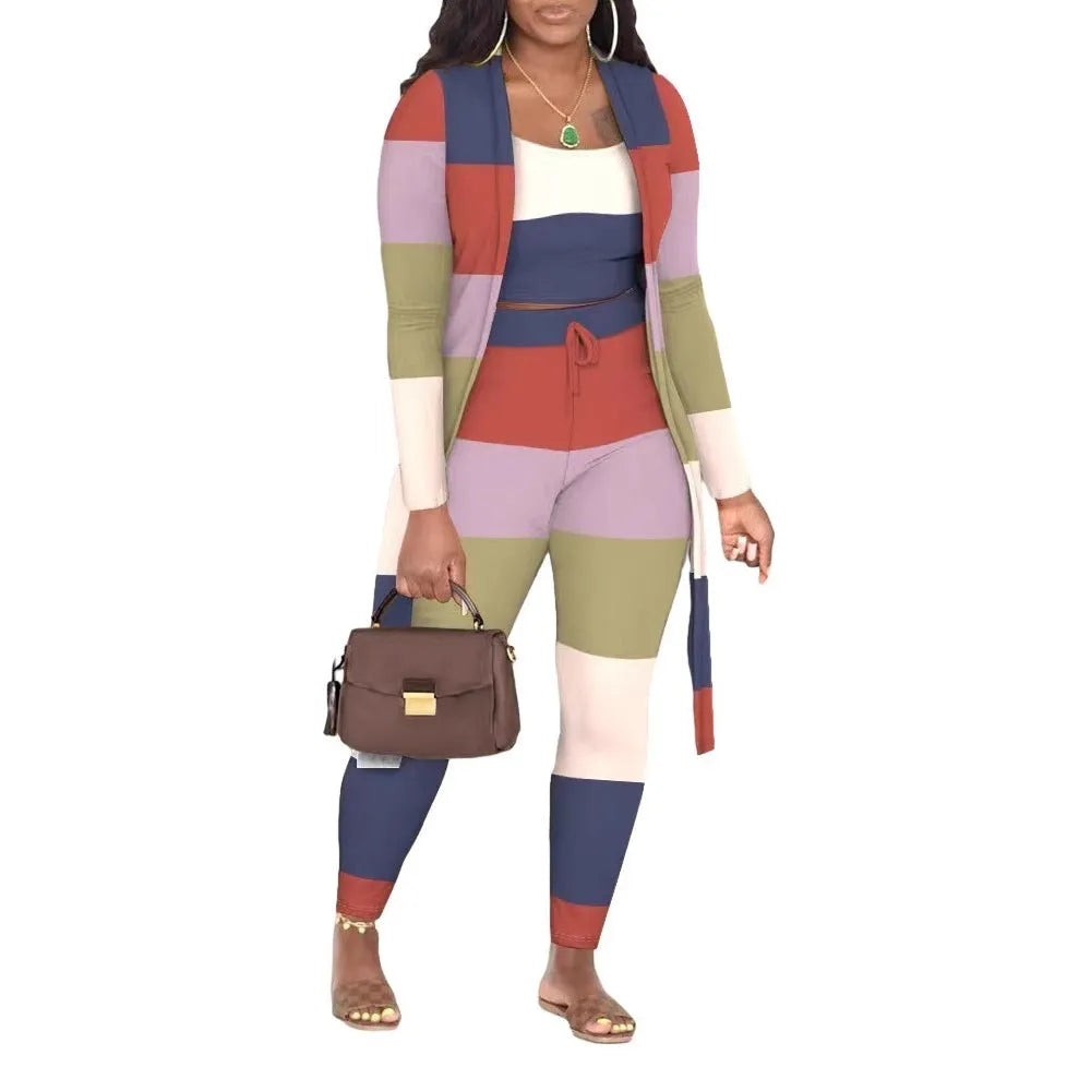 Women's multicolour plaid three-piece set with long sleeve coat, vest and trousers on model