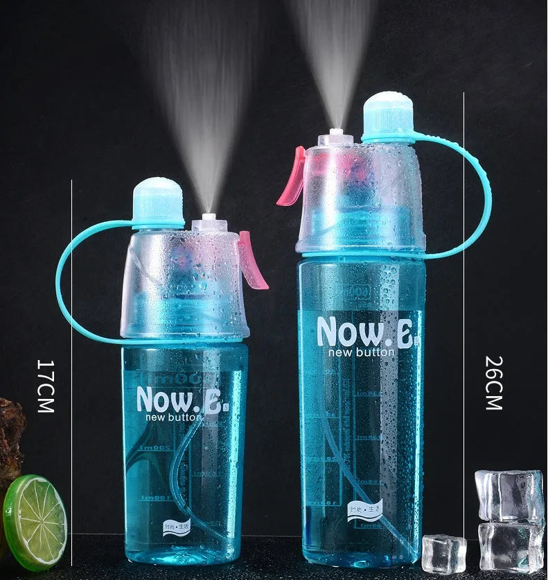 Green portable sports mist spray cup with transparent body, scale markings, and a black spray mouth cap.
